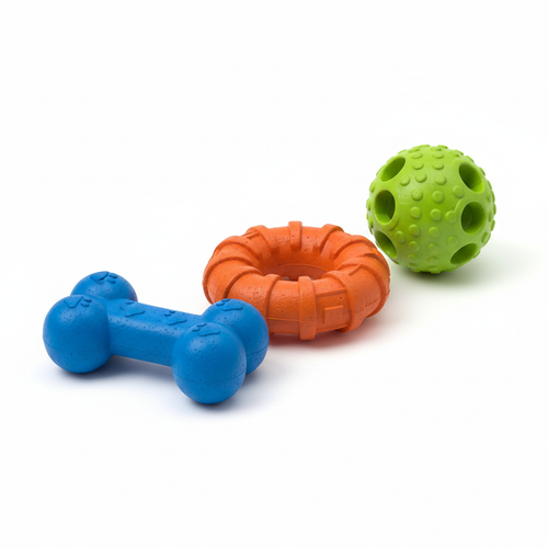 Set of colorful rubber dog chew toys including bone, ring and ball