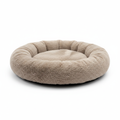 Round fluffy calming donut dog bed in beige plush